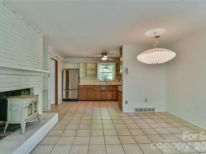 1 Hillcrest Lane, Black Mountain, NC 28711.  MLS# CAR4368421, YatesRealty ID 20131. Open and airy dining area