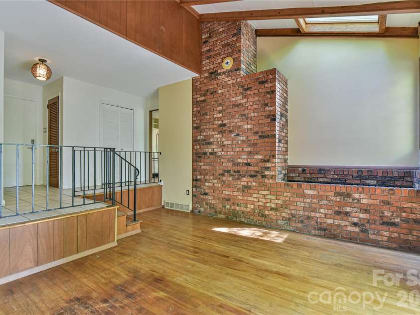 1 Hillcrest Lane, Black Mountain, NC 28711.  MLS# CAR4368421, YatesRealty ID 20131. Quintessential sunken living room
