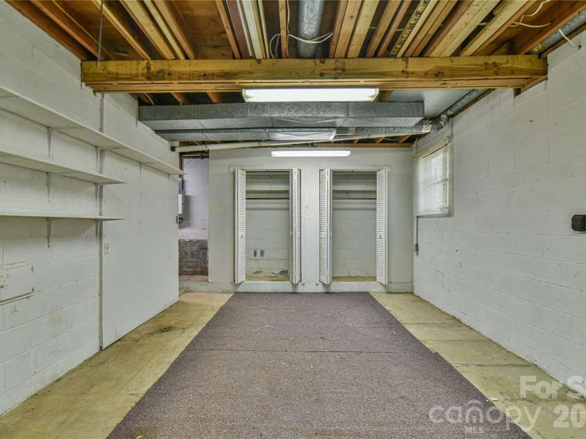 1 Hillcrest Lane, Black Mountain, NC 28711.  MLS# CAR4368421, YatesRealty ID 20131. The basement workshop