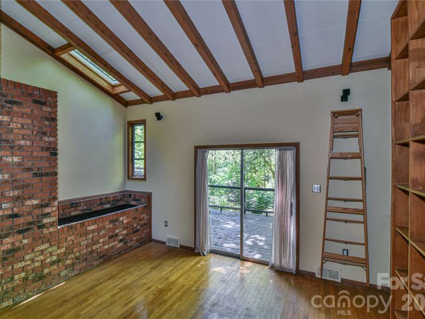 1 Hillcrest Lane, Black Mountain, NC 28711.  MLS# CAR4368421, YatesRealty ID 20131. Vaulted ceilings with a suncatching skylight