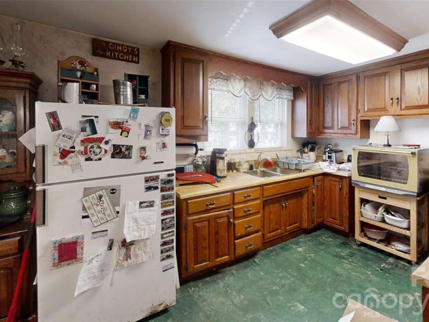 21 Maple Avenue, Candler, NC 28715.  MLS# CAR4273168, YatesRealty ID 2014. Kitchen view