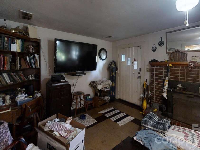 21 Maple Avenue, Candler, NC 28715.  MLS# CAR4273168, YatesRealty ID 2014. Living room front door view