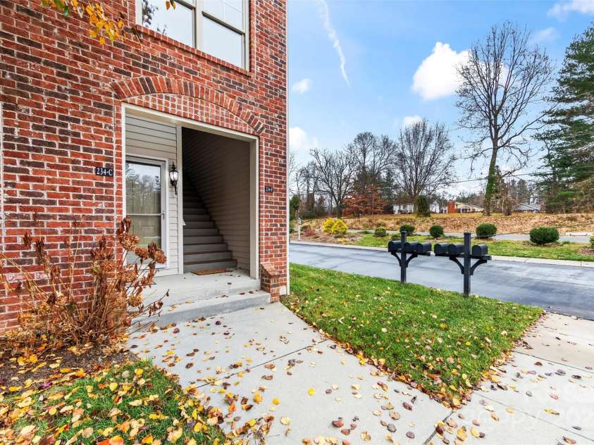 234 Wash Creek Drive, Hendersonville, NC 28739.  MLS# CAR4325434, YatesRealty ID 20140. The stairs will lead you to the front door.