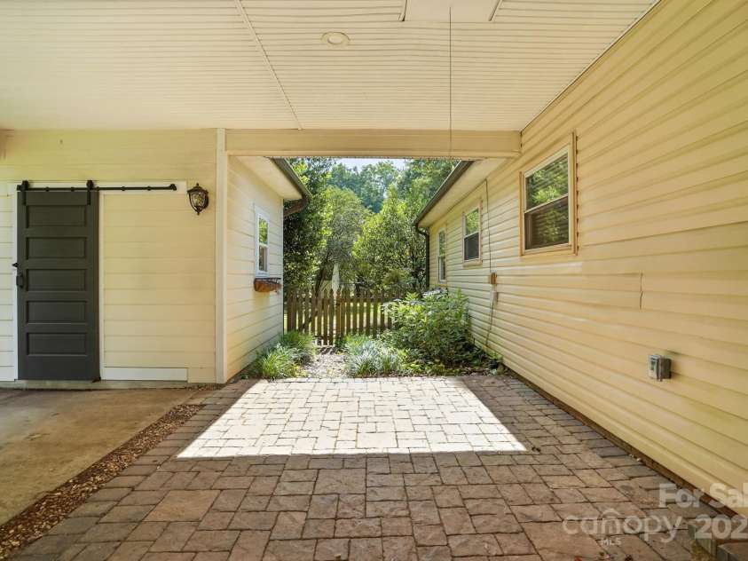 5229 Milford Road, Charlotte, NC 28210.  MLS# CAR4271289, YatesRealty ID 20144. Carport with pavers