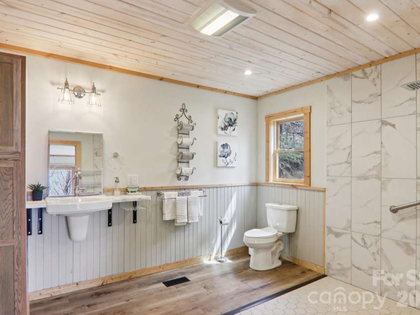2665 El Miner Drive, Mars Hill, NC 28754.  MLS# CAR4374532, YatesRealty ID 20145. Large mobility friendly primary bathroom.