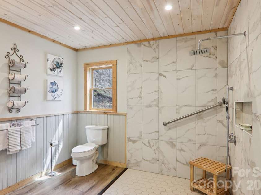 2665 El Miner Drive, Mars Hill, NC 28754.  MLS# CAR4374532, YatesRealty ID 20145. Large mobility friendly primary bathroom.