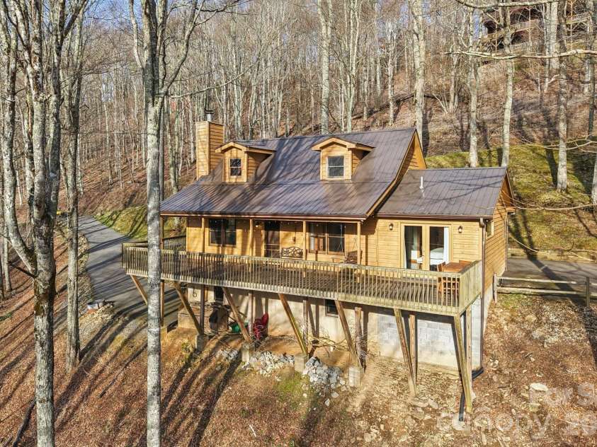 2665 El Miner Drive, Mars Hill, NC 28754.  MLS# CAR4374532, YatesRealty ID 20145. Outdoor entertaining on the covered & uncovered deck.