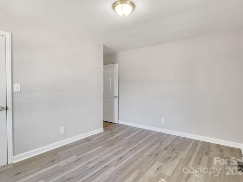 3637 Glenville Avenue, Charlotte, NC 28215.  MLS# CAR4257290, YatesRealty ID 20152. Second shot of first bedroom, facing entry door on far right.