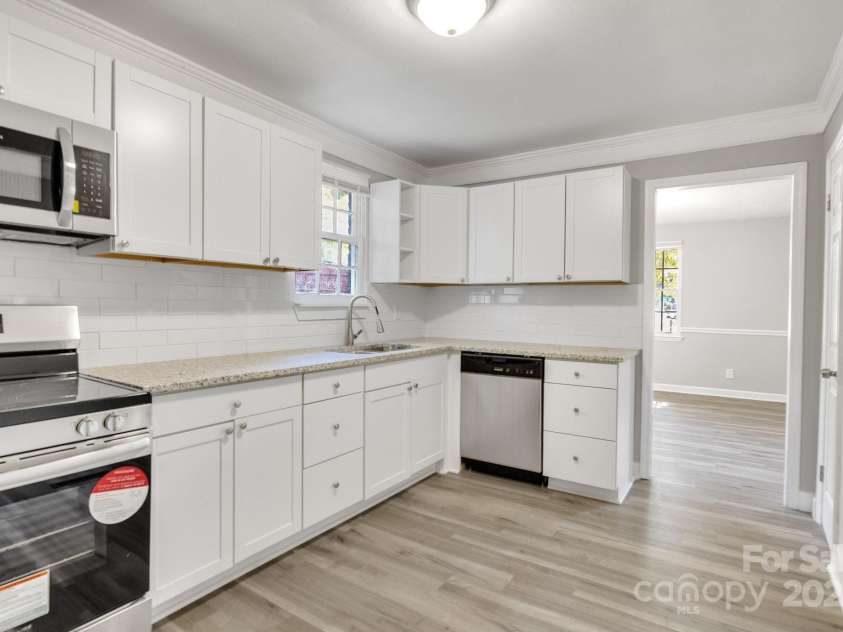 3637 Glenville Avenue, Charlotte, NC 28215.  MLS# CAR4257290, YatesRealty ID 20152. Second shot of the kitchen. Open entry way leads back to living room.