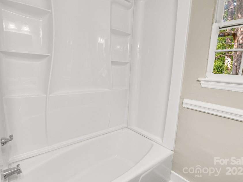 3637 Glenville Avenue, Charlotte, NC 28215.  MLS# CAR4257290, YatesRealty ID 20152. Shower/bath features direct-to-stud alcove tub w/ wall surround.