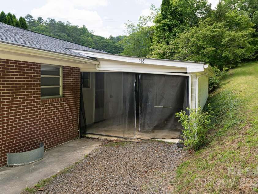 546 Scronce Creek Road, Burnsville, NC 28714.  MLS# CAR4243837, YatesRealty ID 20153. Apartment Carport, Storage or Workshop