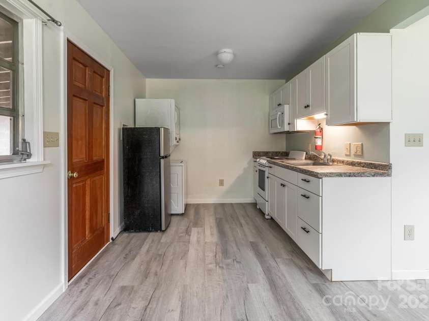 546 Scronce Creek Road, Burnsville, NC 28714.  MLS# CAR4243837, YatesRealty ID 20153. Apartment Entry and Kitchen