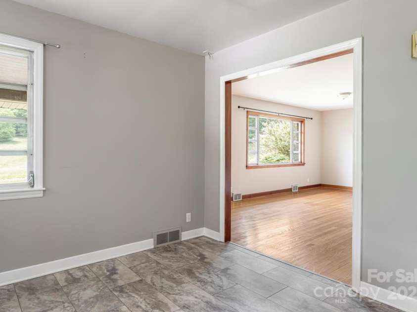 546 Scronce Creek Road, Burnsville, NC 28714.  MLS# CAR4243837, YatesRealty ID 20153. Dining to Living Room