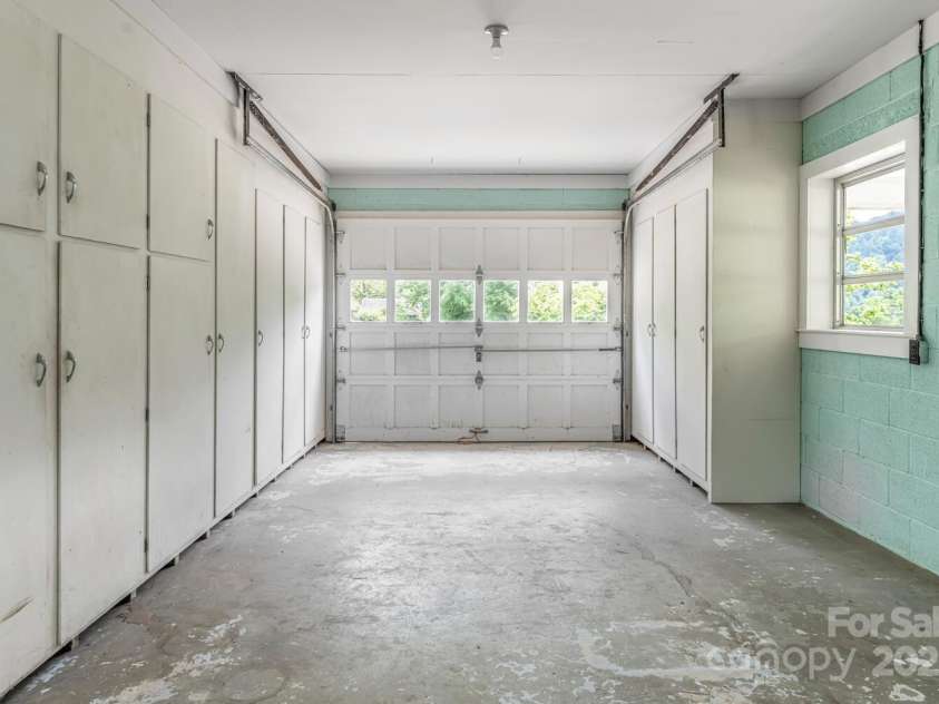 546 Scronce Creek Road, Burnsville, NC 28714.  MLS# CAR4243837, YatesRealty ID 20153. Garage with built-in storage.