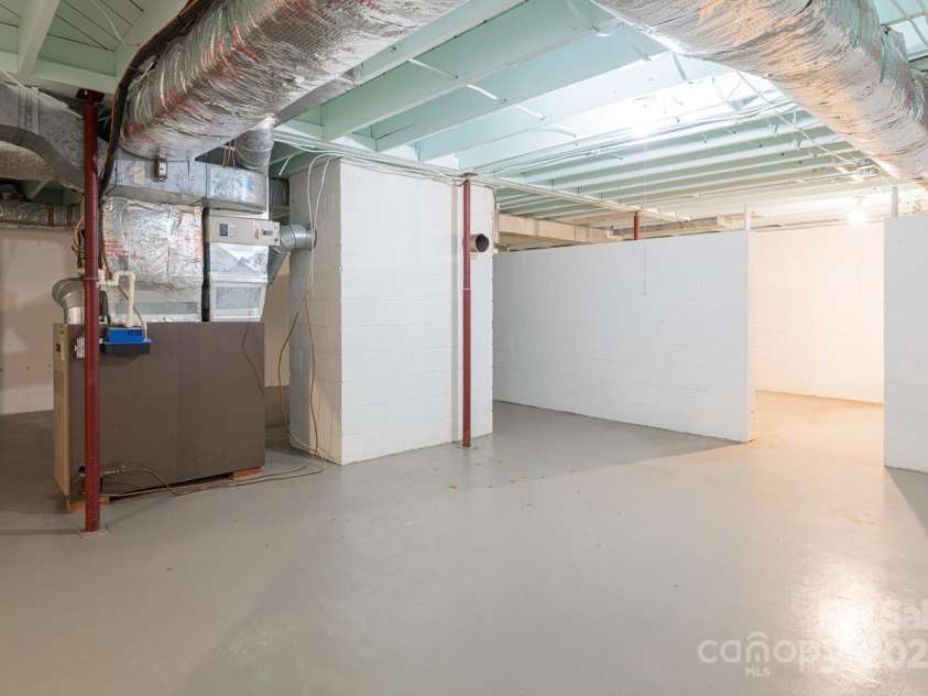 546 Scronce Creek Road, Burnsville, NC 28714.  MLS# CAR4243837, YatesRealty ID 20153. Large clean basement