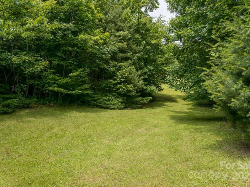 546 Scronce Creek Road, Burnsville, NC 28714.  MLS# CAR4243837, YatesRealty ID 20153. Large garden and field area.