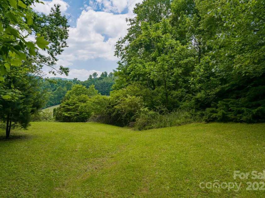 546 Scronce Creek Road, Burnsville, NC 28714.  MLS# CAR4243837, YatesRealty ID 20153. Large garden and field area.