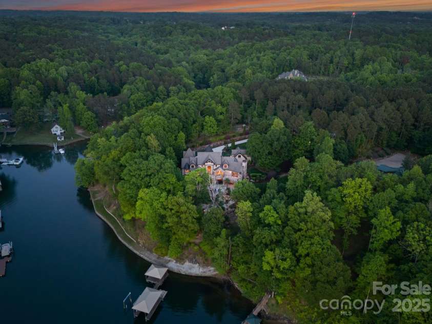 172 Tennessee Circle, Mooresville, NC 28117.  MLS# CAR4252701, YatesRealty ID 20154. Aerial view of the home featuring stunning views of Lake Norman.