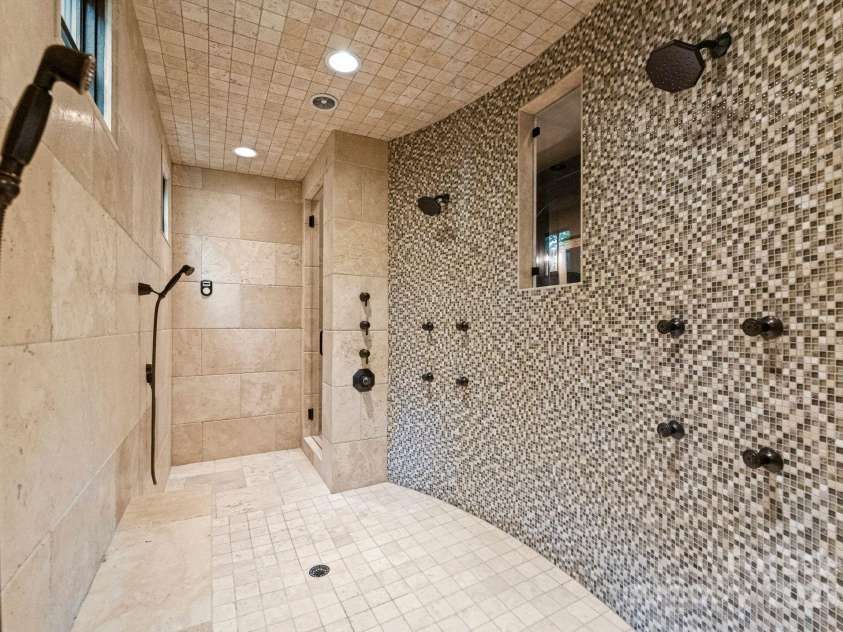 172 Tennessee Circle, Mooresville, NC 28117.  MLS# CAR4252701, YatesRealty ID 20154. Spa bath with jetted tub, steam shower, and vanities.
