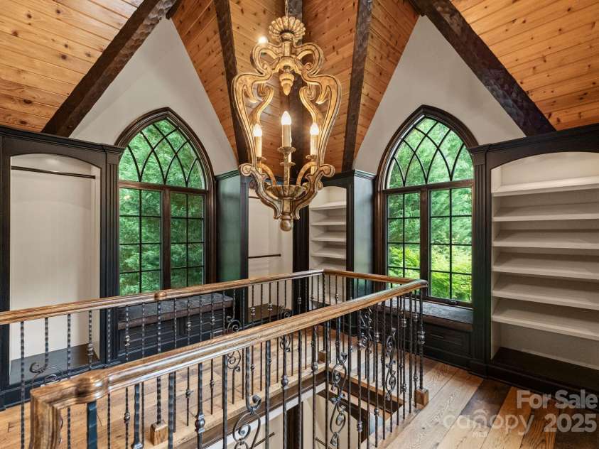 172 Tennessee Circle, Mooresville, NC 28117.  MLS# CAR4252701, YatesRealty ID 20154. Two-story boutique closet with light-filled luxury storage.