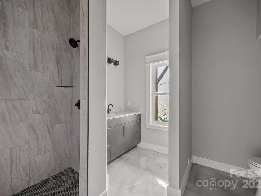 64 Pinedale Road, Asheville, NC 28805.  MLS# CAR4210375, YatesRealty ID 20158. Lower level full bath