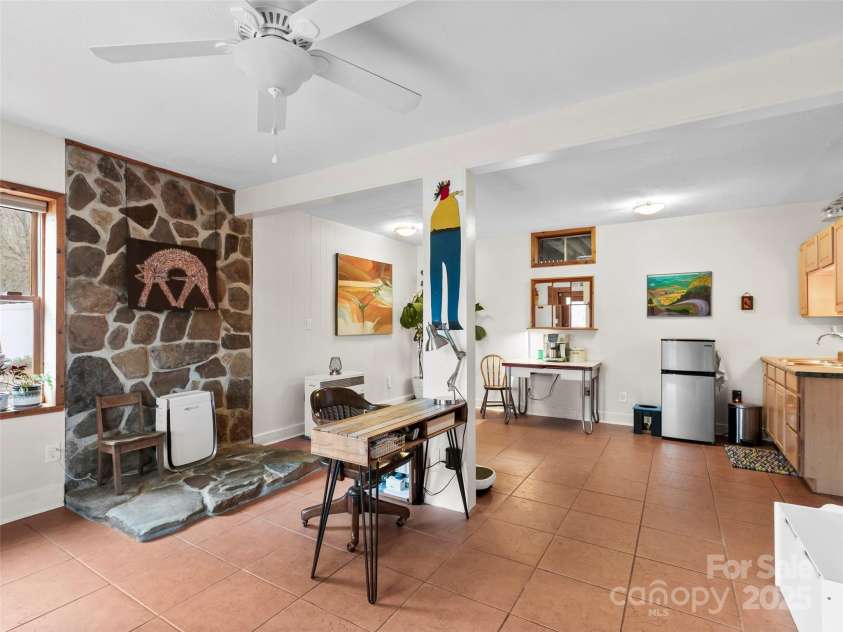 1239 Lower Loop Drive, Fletcher, NC 28732.  MLS# CAR4327631, YatesRealty ID 2016. Family Room with kitchenette in basement 