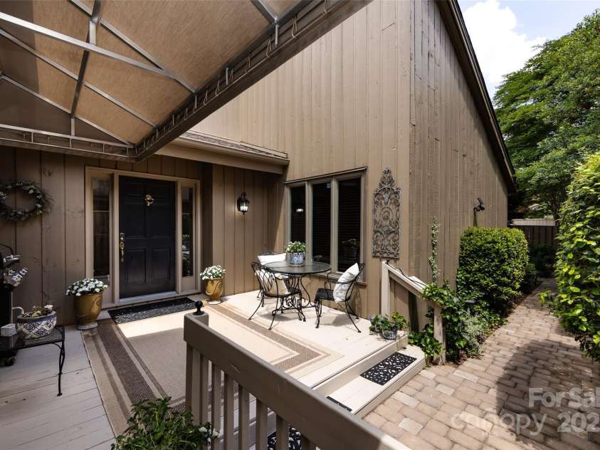 5128 Dunes Court, Charlotte, NC 28226.  MLS# CAR4249408, YatesRealty ID 20161. Front Porch with sliding doors to kitchen