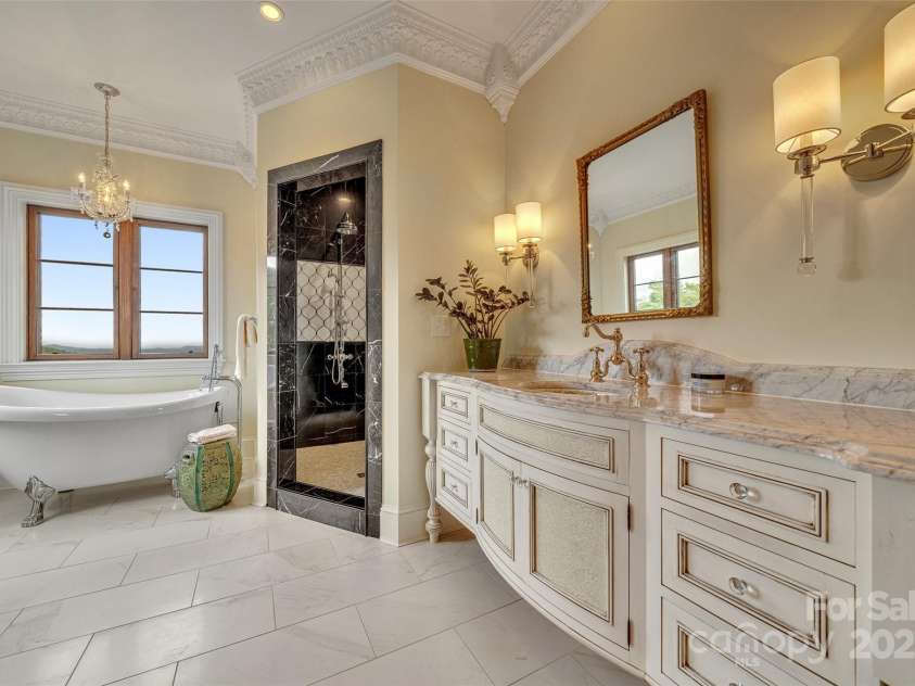278 Snow Ridge Drive, Hendersonville, NC 28792.  MLS# CAR4221130, YatesRealty ID 20164. Primary bathroom with marble shower and clawfoot soaking tub.