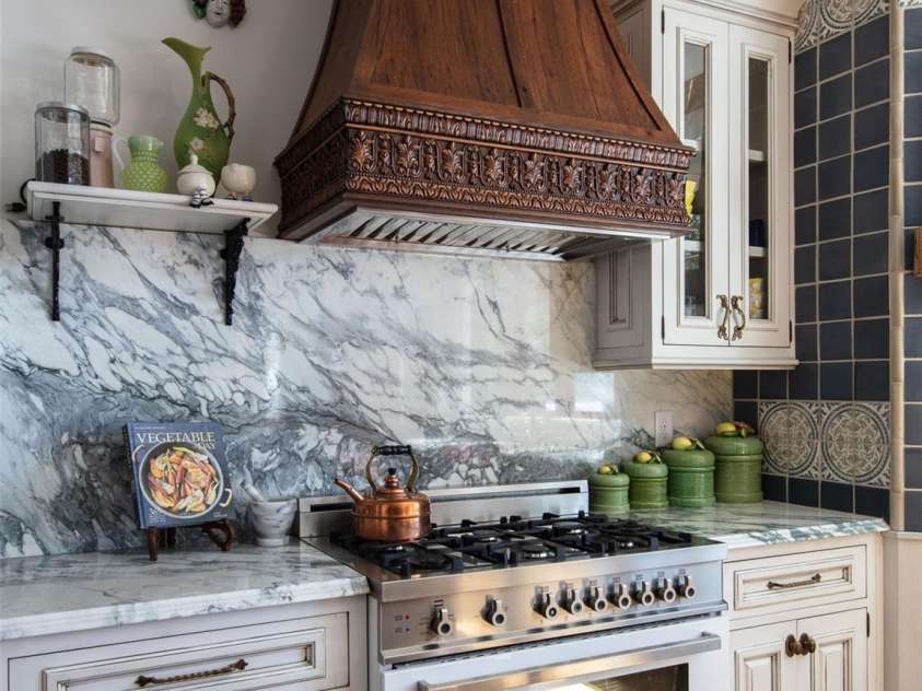 278 Snow Ridge Drive, Hendersonville, NC 28792.  MLS# CAR4221130, YatesRealty ID 20164. The kitchen features exquisite marble, antique French tiles, custom cabinetry Miele refrigerator, and Bertazzoni range.