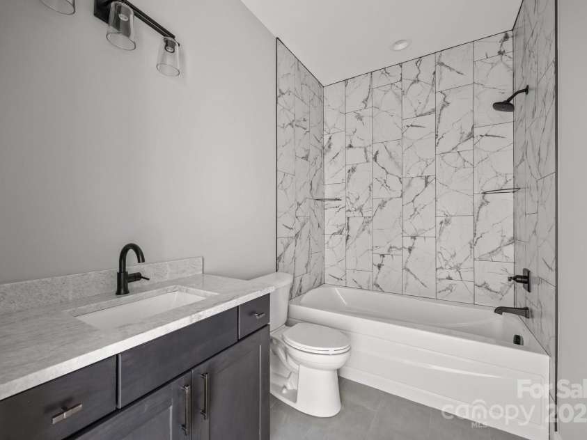 62 Pinedale Road, Asheville, NC 28805.  MLS# CAR4210140, YatesRealty ID 20166. Lower level full bath