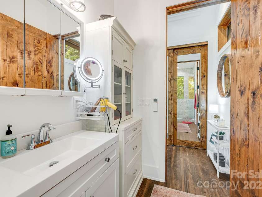 265 Laurel Branch Road, Canton, NC 28716.  MLS# CAR4231718, YatesRealty ID 2017. Hutch in the bathroom, as well as beautiful mirrored hall closet, provide storage for all the things!