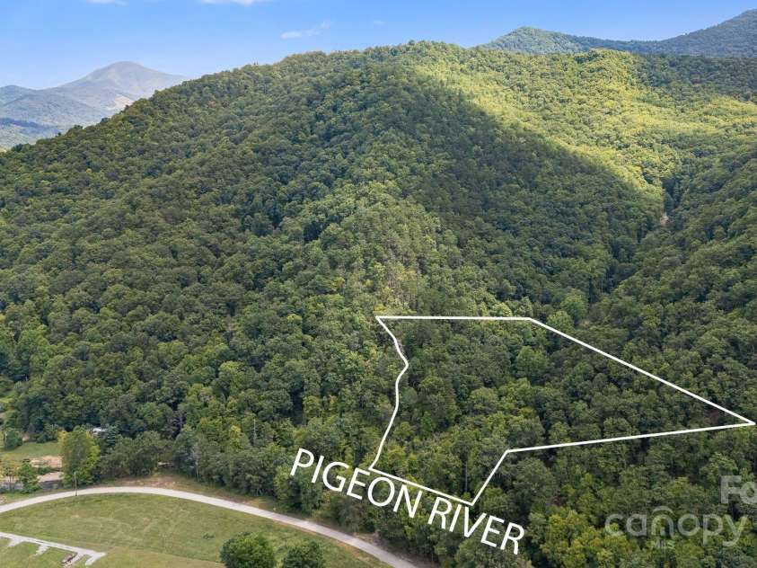265 Laurel Branch Road, Canton, NC 28716.  MLS# CAR4231718, YatesRealty ID 2017. Parcel straddles the Laurel Branch, a mapped stream that traverses the property, and borders the Pigeon River at the bottom, for private access to world class trout fishing!