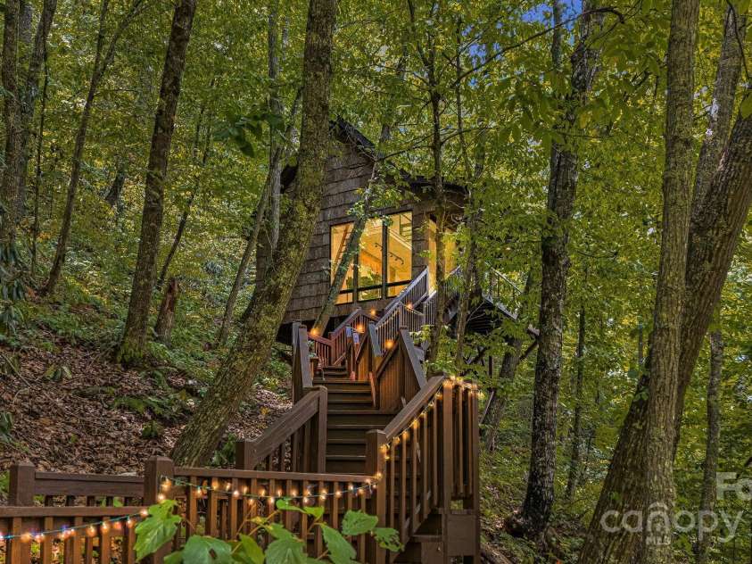 265 Laurel Branch Road, Canton, NC 28716.  MLS# CAR4231718, YatesRealty ID 2017. Steps to heaven! Relax to the sounds of the rushing water and dancing leaves in your glass cabin in the clouds.