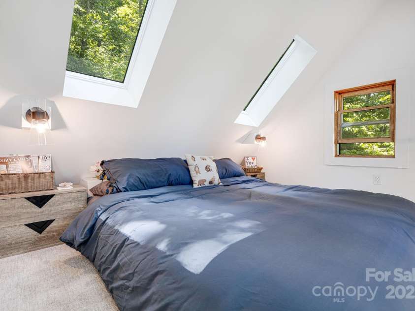 265 Laurel Branch Road, Canton, NC 28716.  MLS# CAR4231718, YatesRealty ID 2017. The views from the bedroom loft skylights will delight! Drift off to views of the stars, and awaken to the sun peeking through the tree canopy while birds flit about!