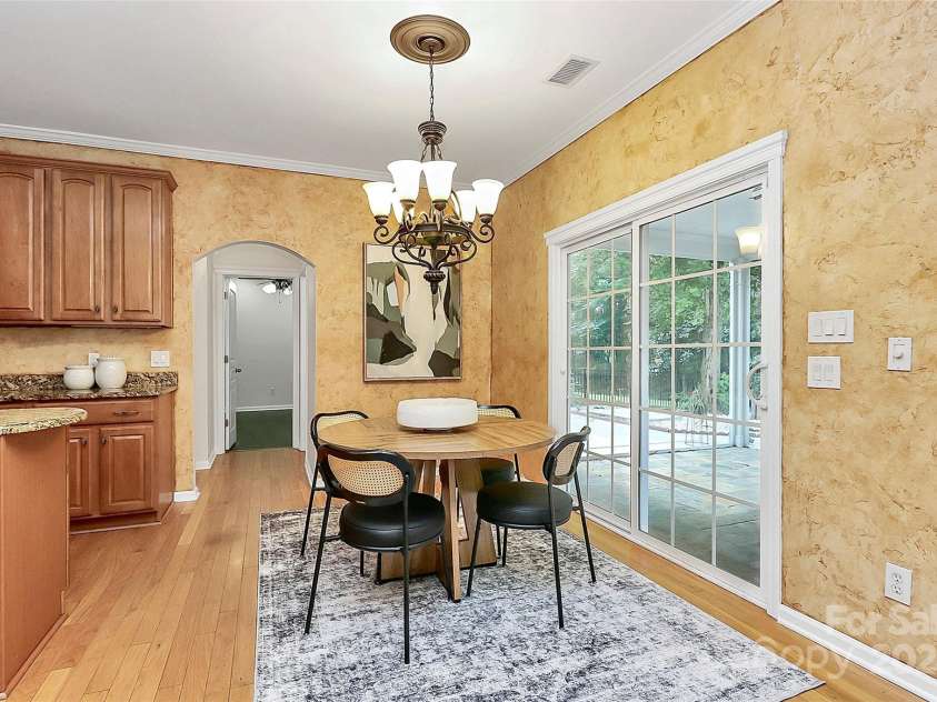 14904 Rosemary Way Drive, Huntersville, NC 28078.  MLS# CAR4266455, YatesRealty ID 20172. Eating area in the kitchen leads to screened patio leading to backyard