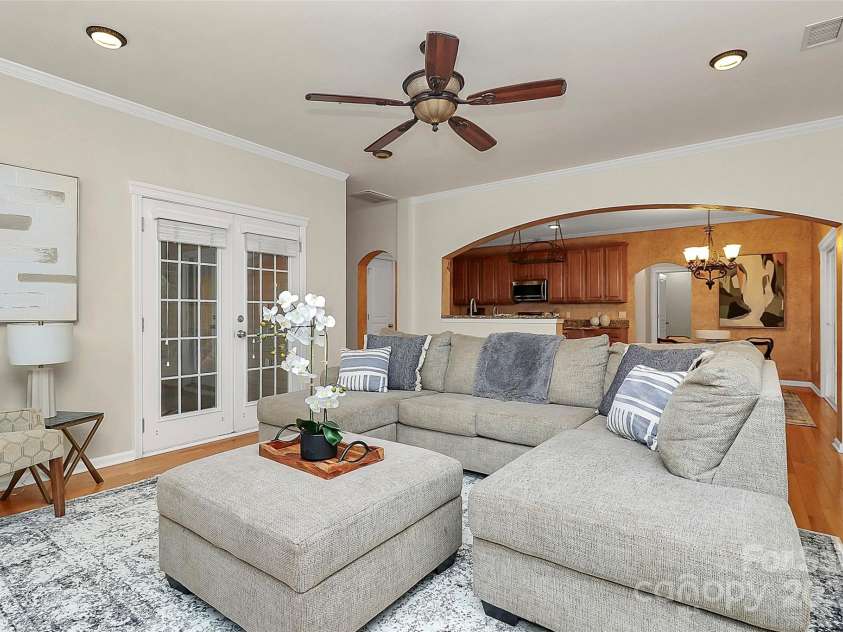 14904 Rosemary Way Drive, Huntersville, NC 28078.  MLS# CAR4266455, YatesRealty ID 20172. Living area  to the kitchen, connect Screened Courtyard room.  Kitchen has been freshly painted to neutral color.