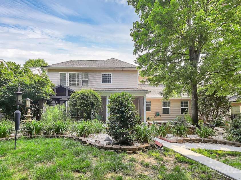 14904 Rosemary Way Drive, Huntersville, NC 28078.  MLS# CAR4266455, YatesRealty ID 20172. Relax to the sounds of the water fountain in front of the pavilon or sit in the screened patio, or take in some sun on the open patio or on a cool night sit by the firepit.  This fenced backyard has everything 