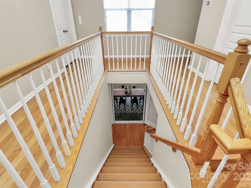 14904 Rosemary Way Drive, Huntersville, NC 28078.  MLS# CAR4266455, YatesRealty ID 20172. View from upstairs to the screened courtyard room with the doors opened