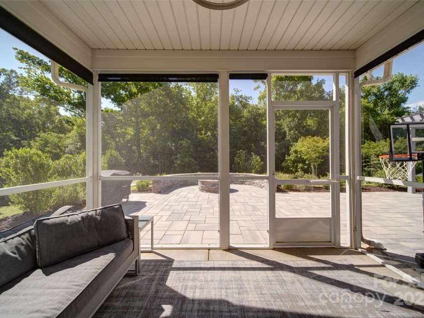 2035 Beacon Avenue, Monroe, NC 28110.  MLS# CAR4265036, YatesRealty ID 20173. Screened in sunroom with easy access to back