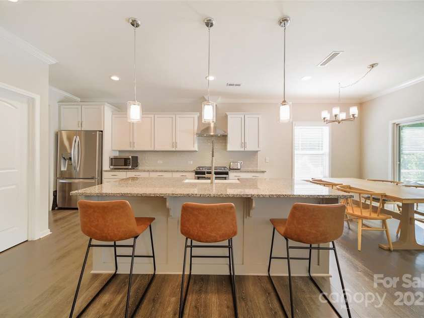 2035 Beacon Avenue, Monroe, NC 28110.  MLS# CAR4265036, YatesRealty ID 20173. Seating at the island