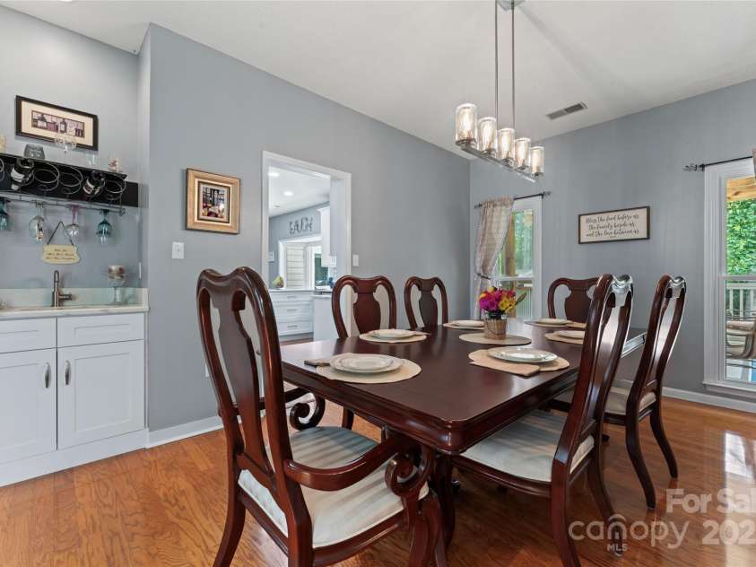 107 Glenmont Court, Mooresville, NC 28117.  MLS# CAR4267304, YatesRealty ID 20176. Formal didning room w/built-in wet bar