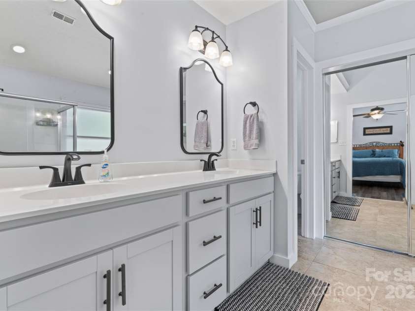 107 Glenmont Court, Mooresville, NC 28117.  MLS# CAR4267304, YatesRealty ID 20176. Primary suite bathroom with dual sinks