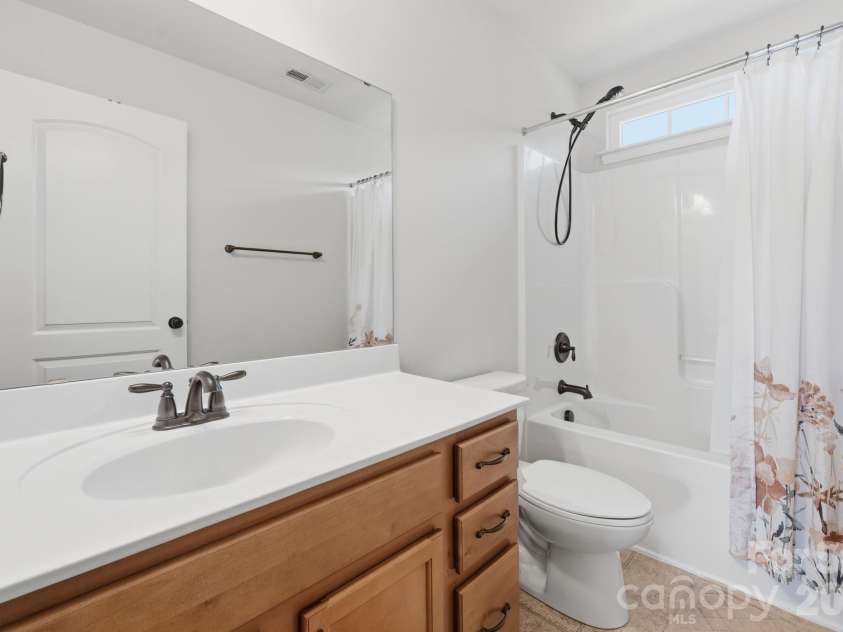 9722 Spring Crest Court, Charlotte, NC 28269.  MLS# CAR4360294, YatesRealty ID 20180. Guest Bathroom