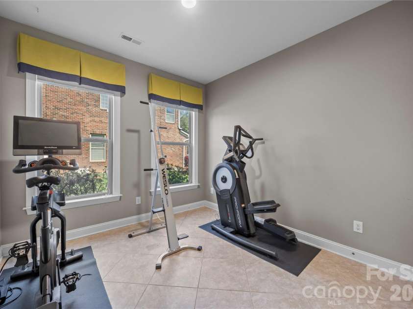 921 Rock Forest Way, Fort Mill, SC 29707.  MLS# CAR4359119, YatesRealty ID 20189. Main level bedroom/gym