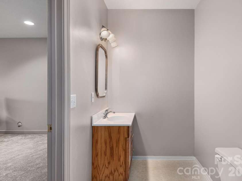 125 Buffalo Trail, Asheville, NC 28805.  MLS# CAR4332345, YatesRealty ID 20200. Half bath in basement