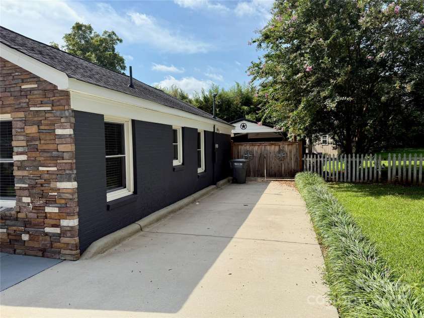 808 Mark Street, Belmont, NC 28012.  MLS# CAR4294048, YatesRealty ID 2021. Large Driveway Leading to Back Carport