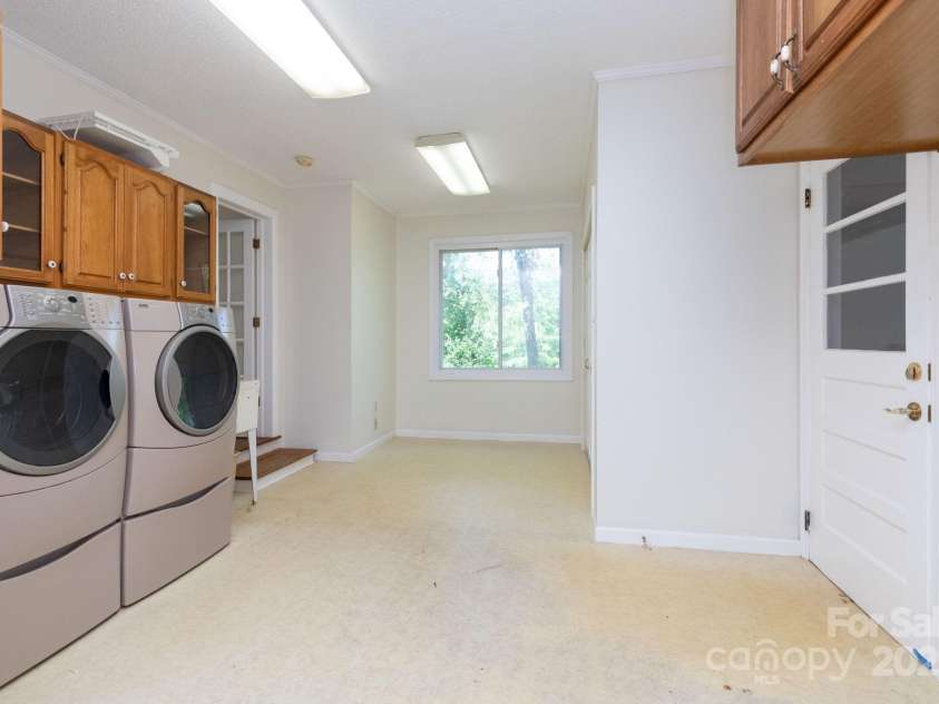 18 Gravely Branch Road, Fletcher, NC 28732.  MLS# CAR4268801, YatesRealty ID 20212. Laundry/Mud/Office