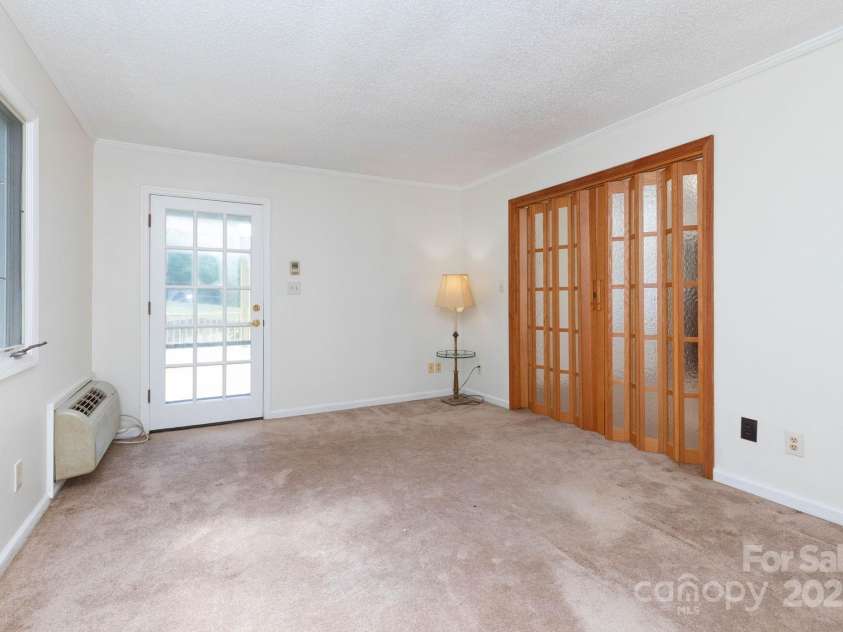 18 Gravely Branch Road, Fletcher, NC 28732.  MLS# CAR4268801, YatesRealty ID 20212. Primary Bedroom