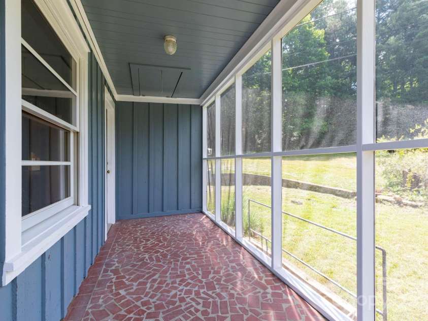 18 Gravely Branch Road, Fletcher, NC 28732.  MLS# CAR4268801, YatesRealty ID 20212. Screened Side Porch