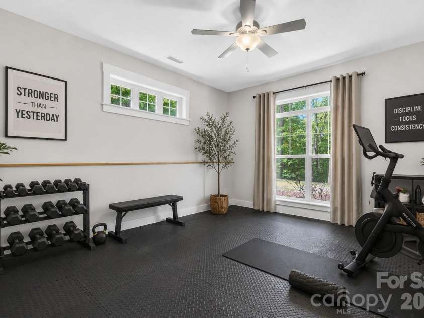 125 Pomeroy Road, Mooresville, NC 28117.  MLS# CAR4378869, YatesRealty ID 20213. Virtually staged basement level gym